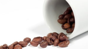 Coffee background: Close-up of a beans, cup